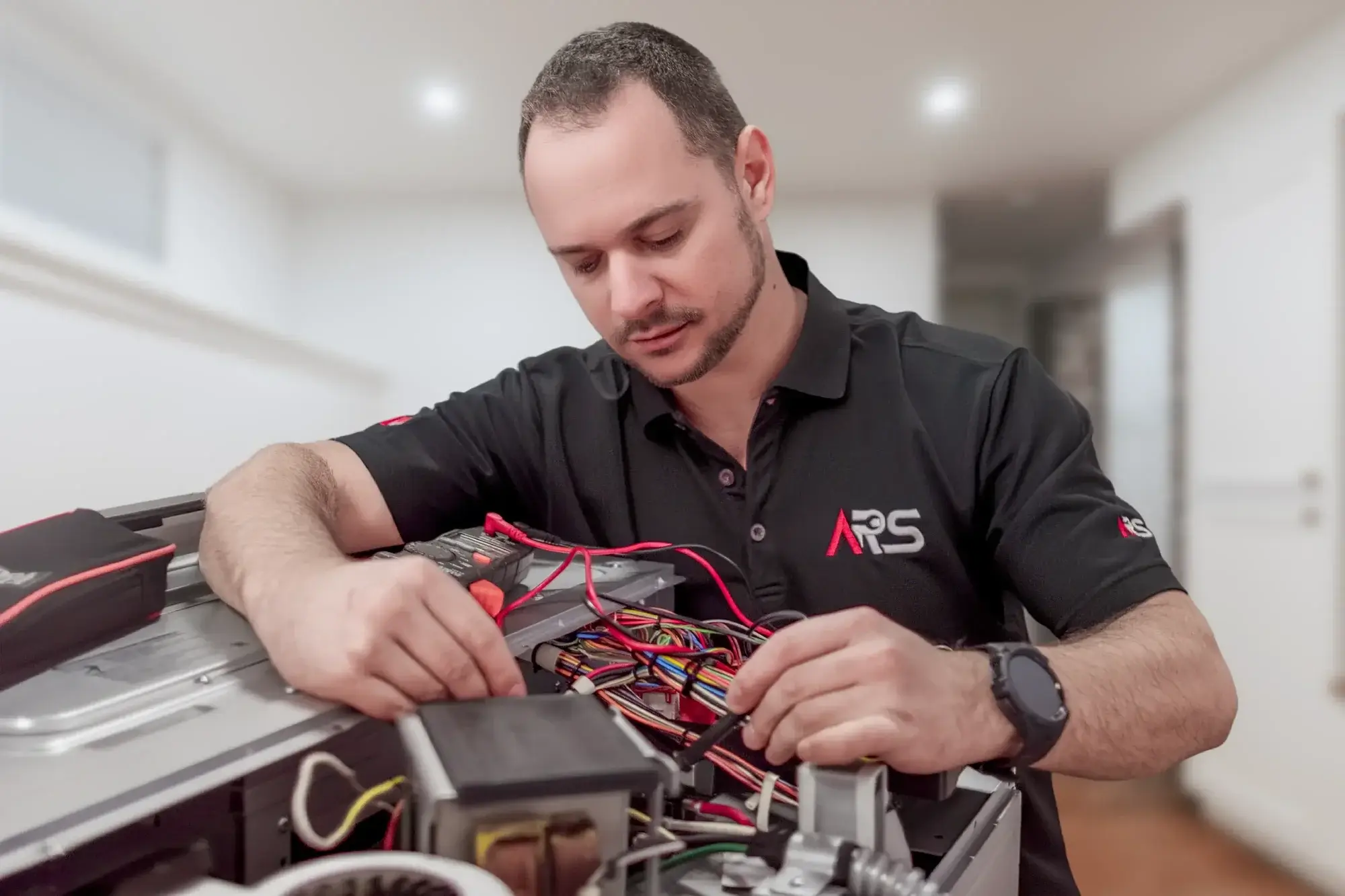 Technician repairing commercial vacuum Technician repairing commercial vacuum