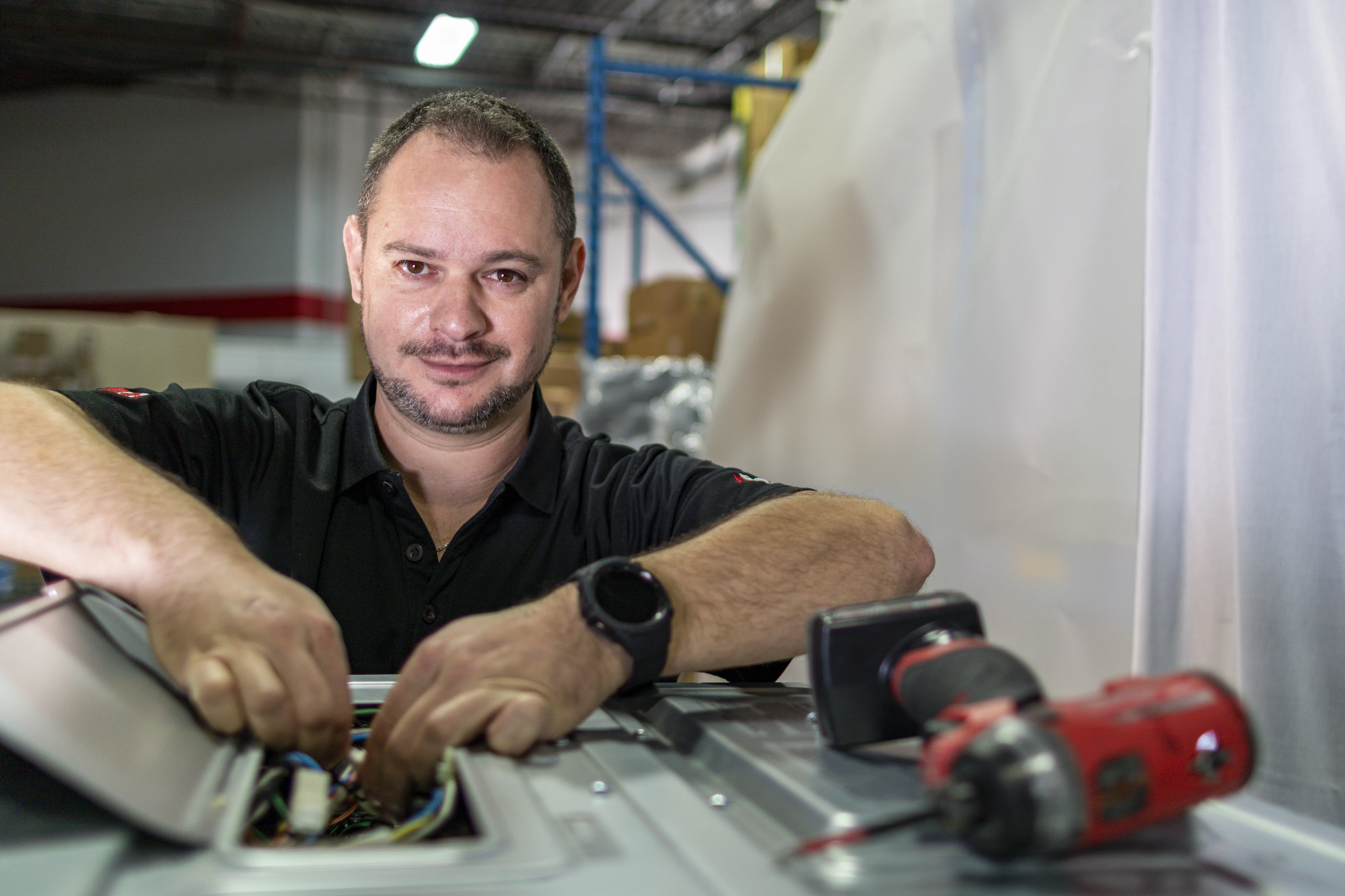 Appliance Repair Technician Working on Electrical Components Appliance Repair Technician Working on Electrical Components