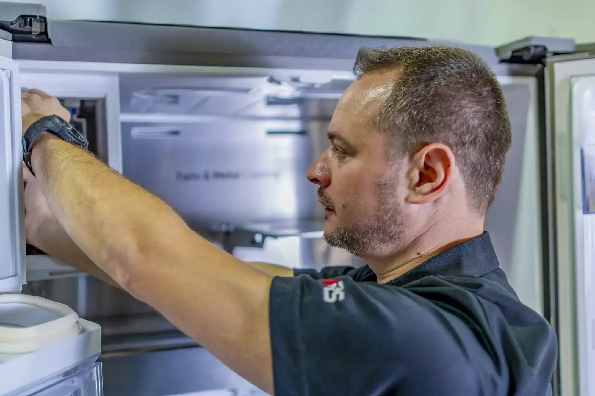 Emergency freezer repair technician servicing unit Emergency freezer repair technician servicing unit